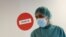 A hospital staff member is pictured before treating a patient suffering from COVID-19 at Hospital del Mar, where an additional ward has been opened to deal with an increase in coronavirus patients in Barcelona, Spain, July 15, 2021. 