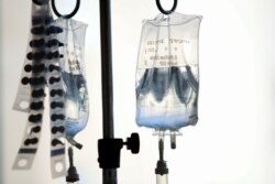 Intravenous bags hang above young cancer patients at Rady's Children Hospital in San Diego, California, Sept. 4, 2019.