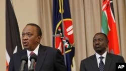 FILE - Kenya's President Uhuru Kenyatta (L) accompanied by Deputy President William Ruto, right, speaks to the media at State House in Nairobi, Kenya, Sept. 21, 2017.