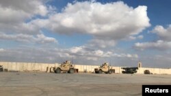 FILE - Military vehicles of U.S. soldiers are seen at Al Asad air base in Iraq on Jan. 13, 2020. The base was one of three attacked as of Nov. 17, 2023, reportedly by the Iranian-backed militia Kataeb Hezbollah.