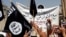 FILE - Demonstrators chant pro-al-Qaida-inspired Islamic State statements as they wave al-Qaida flags in front of the provincial government headquarters in Mosul, Iraq, June 16, 2014.