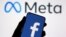 A smartphone with Facebook's logo is seen in front of displayed Facebook's new rebrand logo Meta in this illustration taken Oct. 28, 2021. 