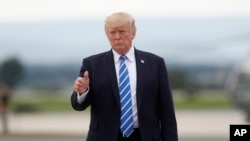 President Donald Trump gives a thumbs-up as walks to board on Air Force One at Hagerstown Regional Airport in Hagerstown, Md., Friday, Aug. 18, 2017, following a national security meeting at Camp David. 
