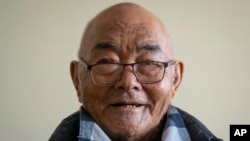 Kanchha Sherpa speaks to Associated Press during an interview at his home in Kathmandu, Nepal, Saturday, March 2, 2024. (AP Photo/Niranjan Shrestha)