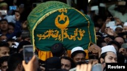 Supporters carry the coffin of Ko Ni, a prominent member of Myanmar's Muslim minority and legal adviser for Myanmar's ruling National League for Democracy, after he was shot dead, in Yangon, Myanmar, Jan. 30, 2017.