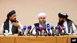 From left, Mohammad Naim, Mawlawi Shahabuddin Dilawar and Suhil Shaheen, members of a political delegation from the Afghan Taliban's movement, attend a news conference in Moscow, July 9, 2021.