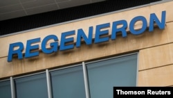 FILE - The Regeneron Pharmaceuticals company logo is seen on a building at the company's Westchester campus in Tarrytown, New York.