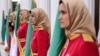 FILE - Mujahedin-e Khalq honor guard members stand watch in Manza, Albania, July 12, 2019. An Iranian paramilitary network was allegedly targeting Mujahedin-e Khalq group members in Albania, police said Wednesday.