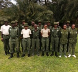 Female rangers at the Olgulului-Ololarashi Group Ranch pose for a group photo with their male colleagues. (Courtesy - Patrick Papatiti, Commander of the Olgululului Community Wildlife Rangers)