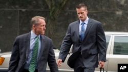 FILE - Former Blackwater Worldwide guard Evan Liberty, right, arrives at federal court in Washington.