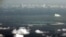FILE - An aerial photo taken though the window of a Philippine military plane shows the land reclamation by China in the Spratly Islands in the South China Sea, west of Palawan, Philippines, May 11, 2015.