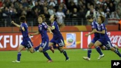 Japanese players celebrate after their team won the Women's World Cup of soccer.