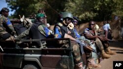 The Malian army patrol the streets of Gao, Northern Mali, Sunday Nov. 24, 2013. Malians have begun voting in legislative elections amid heavy security highlighting fears the poll could be sabotaged by rebel attacks. (AP Photo/Jerome Delay)