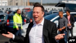 FILE - In this file photo taken on September 03, 2020, Tesla CEO Elon Musk arrives at the construction site of the future US electric car giant Tesla in Gruenheide near Berlin. Elon’s rise to the top of the list is the fastest in history.