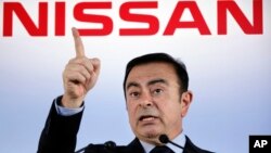 FILE - President and Chief Executive Officer of Nissan Motor Co., Carlos Ghosn speaks during a press conference in Yokohama, near Tokyo, May 11, 2012.