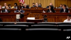 The witness chair reserved for Attorney General William Barr sits empty as Chairman Jerrold Nadler, D-N.Y., center background, gives his opening statement at a House Judiciary Committee hearing on Capitol Hill in Washington, May 2, 2019.