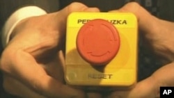 Russian Foreign Minister Sergei Lavrov holds a "reset" button given to him by Secretary of State Hillary Clinton