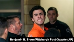 Suspect Luigi Mangione is taken into the Blair County Courthouse in Hollidaysburg, Pennsylvania, Dec. 10, 2024. (Benjamin B. Braun/Pittsburgh Post-Gazette via AP)