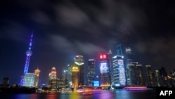 This photo taken on July 20, 2015 shows clouds above the financial district of Pudong in Shanghai. 