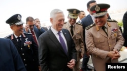 Egypt's Minister of Defense Sedki Sobhi (R) greets U.S. Defense Secretary Jim Mattis (C) upon his arrival at Cairo International Airport in Cairo, Egypt, April 20, 2017.