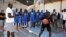 Olumide Oyedeji, a former NBA player, works with young players at the skills development station of the National Basketball Association's first training academy in Thies, east of Dakar, Senegal, May 2, 2017.