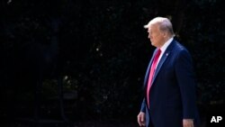 FILE - President Donald Trump walks from the Oval Office as he leaves the White House, Sept. 16, 2019, in Washington.