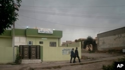 FILE - Defense lawyers leave Nineveh Criminal Court, one of two counterterrorism courts in Iraq where suspected Islamic State militants and their associates are tried, in Tel Keif, Iraq, Apr. 26, 2018.