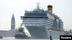 The Costa Deliziosa cruise ship passes in the Saint Mark Basin in Venice, Italy, June 9, 2019. 