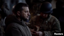 Ukraine's President Volodymyr Zelenskyy visits Ukrainian service members at their position in the frontline town of Bakhmut, amid Russia's attack on Ukraine, in Donetsk region, Ukraine Dec. 20, 2022. 