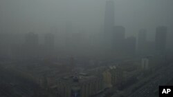 Skyscrapers are obscure by heavy haze in Beijing Jan. 13, 2013.