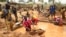 FILE - Miners work at a mining site in the Cameroonian town of Betare Oya, April 4, 2018.