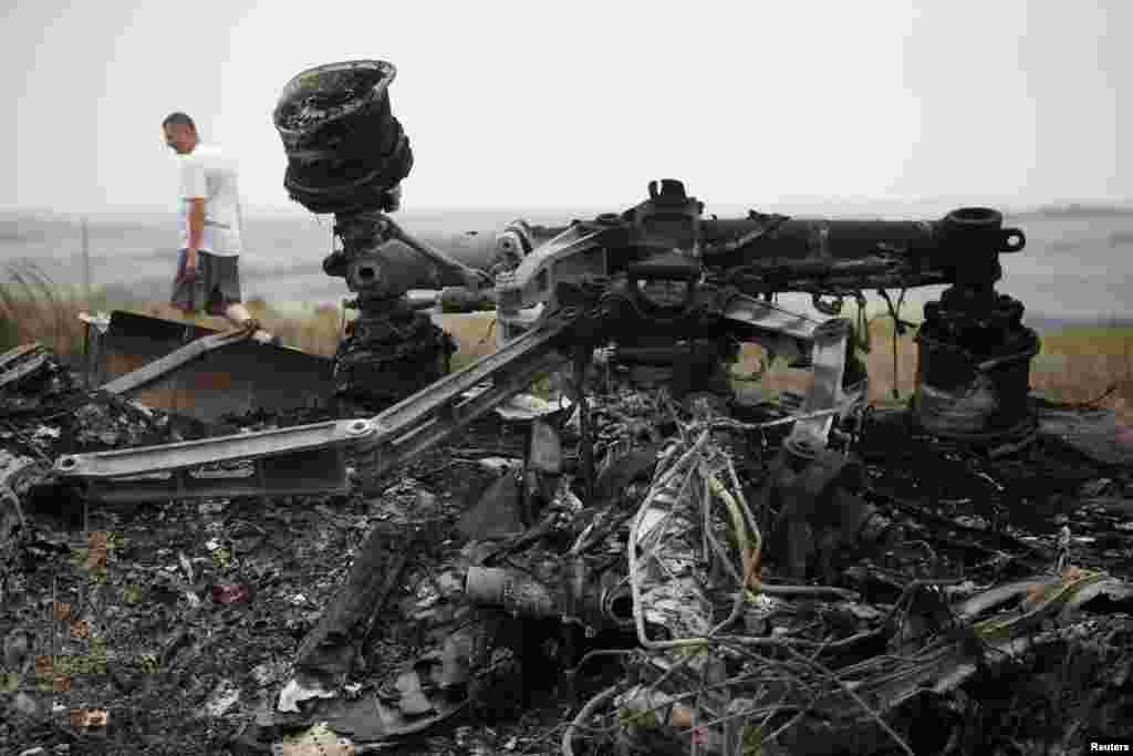 Debris is pictured at the site of the Malaysia Airlines Boeing 777 plane crash, near the village of Grabovo, in the Donetsk region, July 18, 2014.