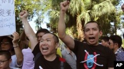 Vientnamese protesters chant anti-China slogans in Hanoi, Vietnam Thursday, June 19, 2014.
