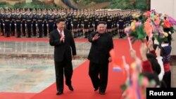 Chinese President Xi Jinping holds a welcoming ceremony for North Korean leader Kim Jong Un before their talks at the Great Hall of the People in Beijing, Jan. 8, 2019, in this picture released by Xinhua, Jan. 10, 2019.