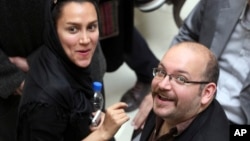 FILE - Jason Rezaian, a Washington Post, reporter, is pictured with his wife, Yeganeh Salehi, an Iranian correspondent for the Abu Dhabi-based newspaper The National.