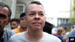 FILE - Andrew Craig Brunson, an evangelical pastor from Black Mountain, North Carolina, arrives at his house in Izmir, Turkey, July 25, 2018, where he is being held under house arrest.