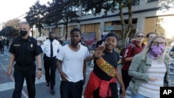 Seattle officials were on hand to try and negotiate with protesters after workers and trucks from the Seattle Department of Transportation arrived with the intention of removing barricades were met with resistance, June 26, 2020. 