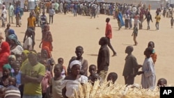 FILE - People who fled their homes due to violence from the Islamic extremists group Boko Haram are seen inside a refugee camp in Minawao, Cameroon, Feb. 25, 2015.