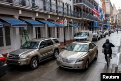 Cars drive along Bourbon Street after it was opened to regular traffic two days after a U.S. Army veteran drove his truck into the crowded French Quarter on New Year's Day in New Orleans, La., Jan. 3, 2025.