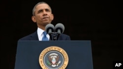 President Barack Obama pauses while speaking at a ceremony in Washington, Aug. 28, 2013. 