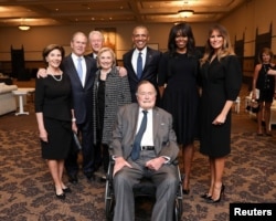 FILE - Former U.S. Presidents and former U.S. first ladies Laura Bush, George W. Bush, Bill Clinton, Hillary Clinton, Barack Obama, Michelle Obama, and first lady Melania Trump pose with former U.S. President George H.W. Bush at the funeral of Barbara Bush in Houston.
