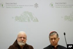 Cardinal Blase J. Cupich, Chicago Archbishop, right, and Cardinal Sean Patrick O'Malley, listen to reporters' questions during a four-day sex abuse summit called by Pope Francis, in Rome, Feb. 22, 2019.