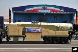 Iran's Khoramshahr missile is displayed by the Revolutionary Guard during a military parade marking the 37th anniversary of Iraq's 1980 invasion of Iran, outside Tehran, Sept. 22, 2017.