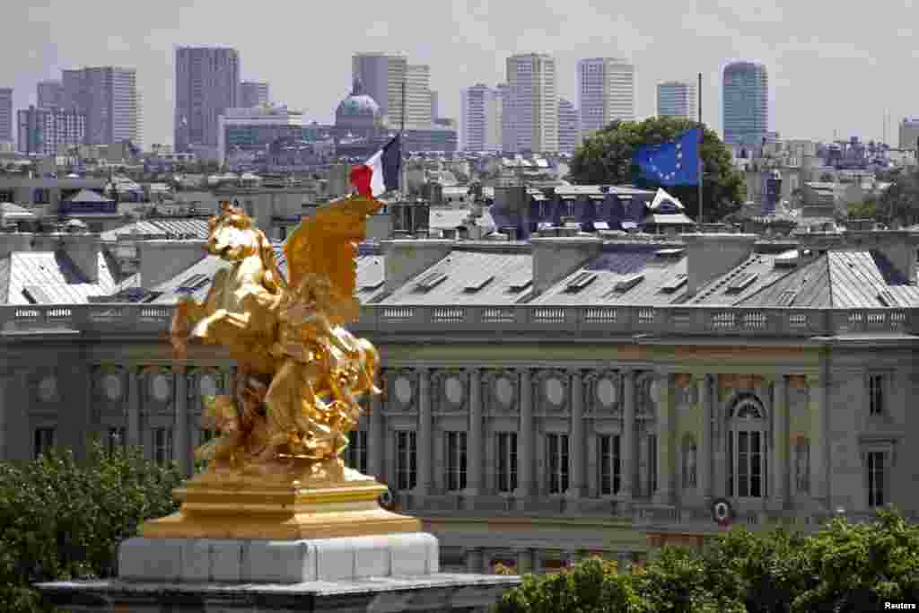 French and European flags fly at half-staff, Quai d&#39;Orsay, in Paris, July 28, 2014.