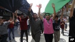 Syrians hold anti-government protest in Aleppo, Syria, July 27, 2012.