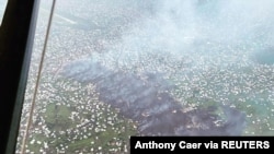 An aerial view shows an area covered by lava from the Mount Nyiragongo volcano eruption, in Goma, Democratic Republic of Congo, May 23, 2021 in this picture obtained from social media. (Virunga National Park/Anthony Caer/via Reuters)