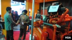 Bangladesh garment factories are starting to install fire extinguishers and hydrant systems after deadly industrial disasters. A fire safety expo featured pumps and other gear. (Amy Yee for VOA)