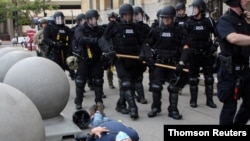 Martin Gugino lies on the ground after he was shoved by two Buffalo, New York, police officers during a protest against the death in Minneapolis police custody of George Floyd.