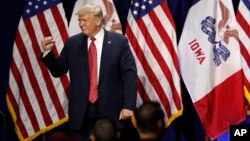 FILE - President Donald Trump acknowledges supporters after speaking at the Republican Party of Iowa's America First Dinner, June 11, 2019, in West Des Moines. 