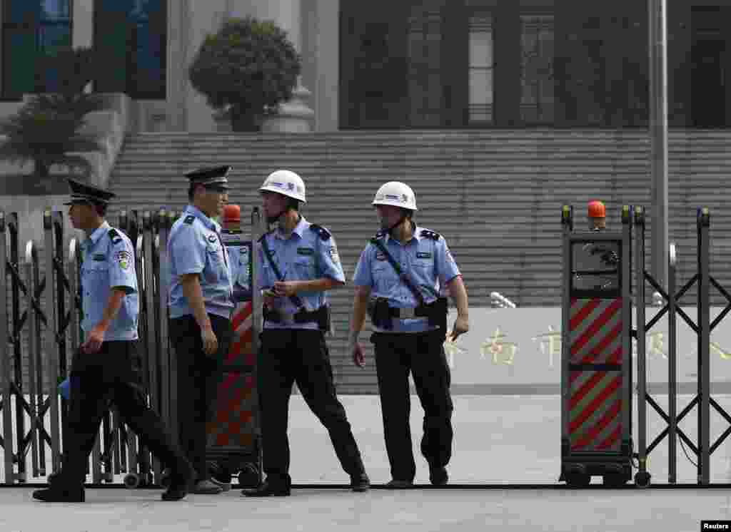 Policemen are seen at a court building where the trial for Bo Xilai was held in Jinan, Shandong province.